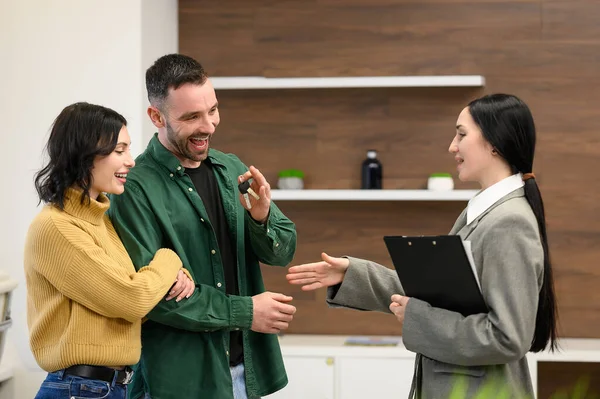 Happy Florida homeowner receiving keys and cash at closing